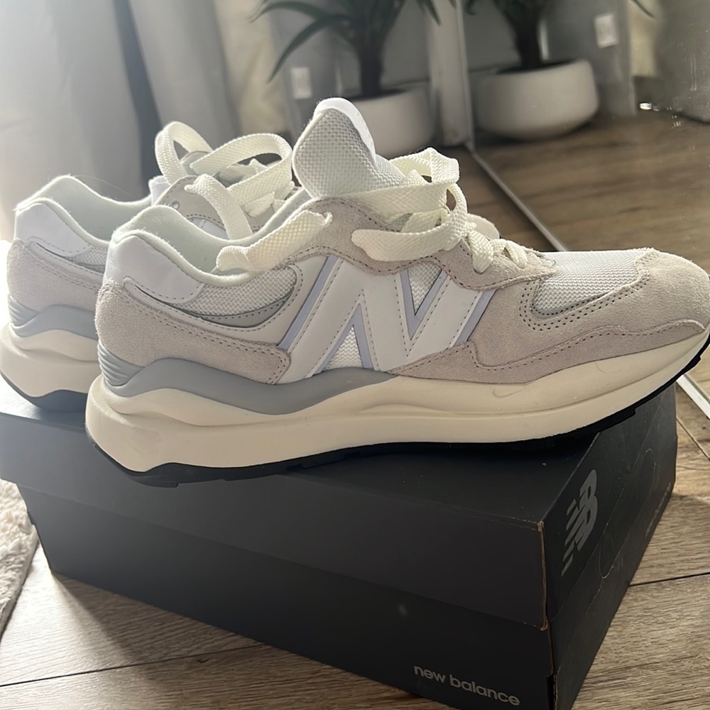 New Balance. Never worn size 8 1/2. With original box.